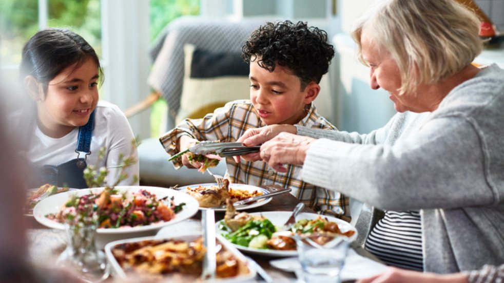 grandma serving children